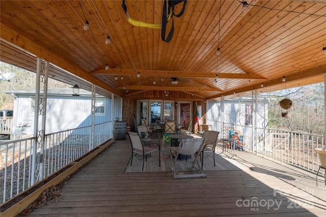 sunroom / solarium with plenty of natural light and wooden ceiling