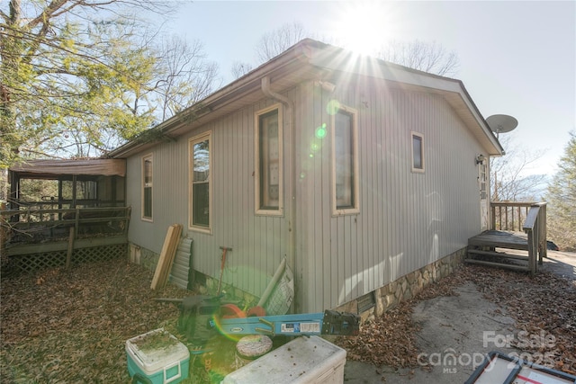 view of home's exterior featuring a deck