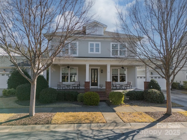 view of front of house with covered porch and a garage