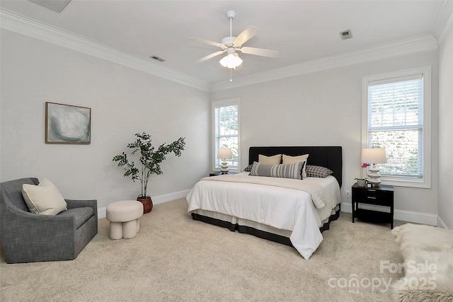 carpeted bedroom with ceiling fan and crown molding