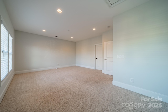 unfurnished room featuring carpet flooring and plenty of natural light