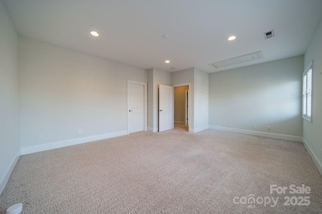 spare room with light colored carpet