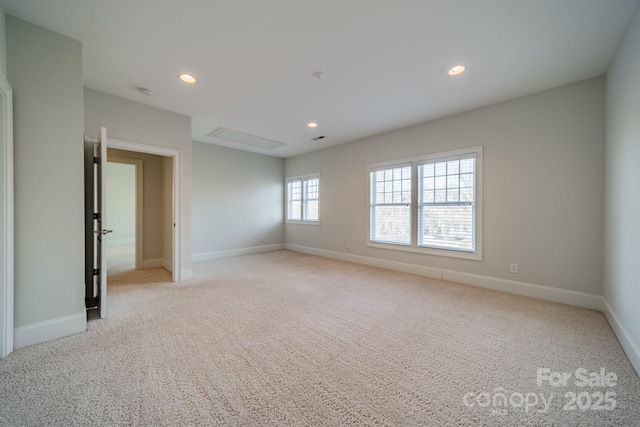 empty room featuring light colored carpet