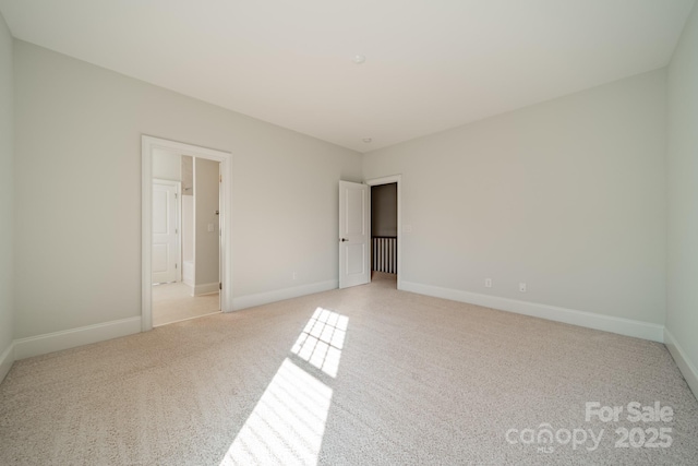 unfurnished bedroom with light colored carpet