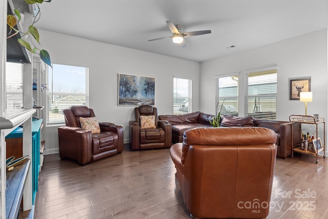 living room featuring hardwood / wood-style flooring and ceiling fan