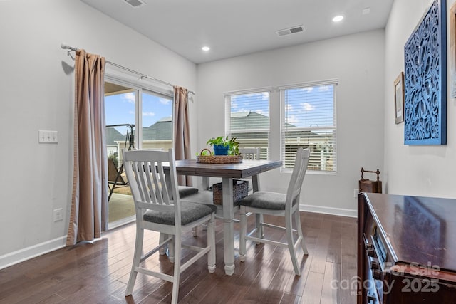 dining area featuring dark hardwood / wood-style floors