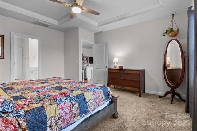 bedroom featuring carpet flooring, ornamental molding, ceiling fan, a raised ceiling, and ensuite bath