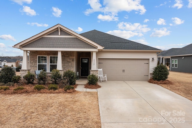 view of front of house with a garage and a porch