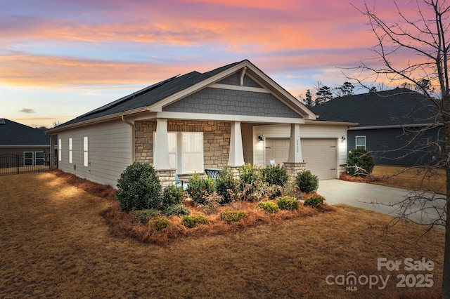 craftsman-style house featuring a garage and covered porch