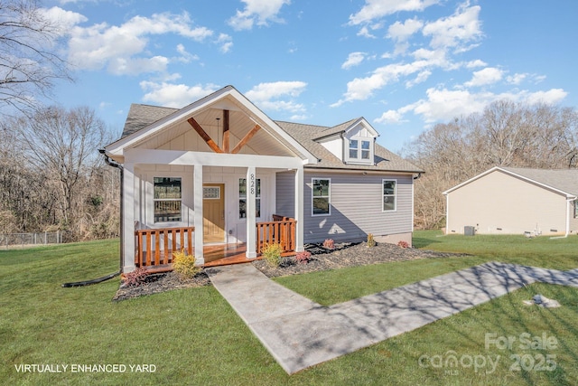 bungalow-style home featuring a front lawn and a porch