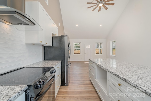 kitchen featuring light hardwood / wood-style flooring, white cabinetry, electric range oven, light stone countertops, and wall chimney exhaust hood