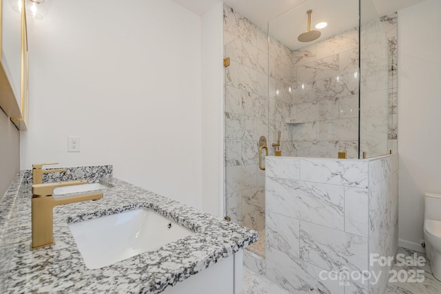 bathroom featuring vanity, toilet, and an enclosed shower