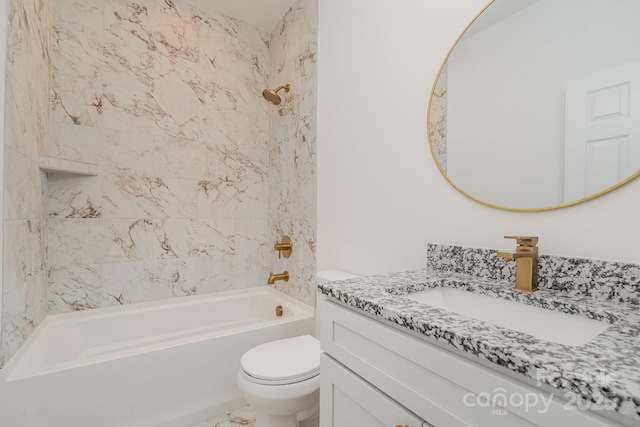 full bathroom with vanity, toilet, and tiled shower / bath