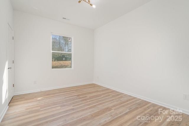 unfurnished room with light hardwood / wood-style floors