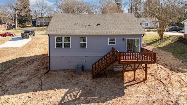 back of house with a wooden deck and central AC