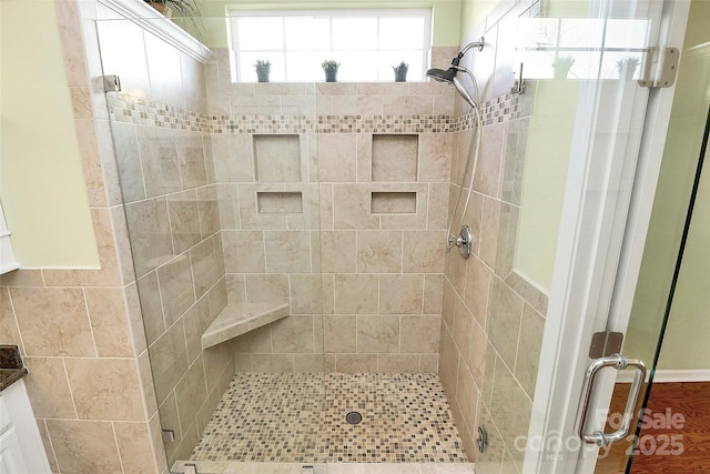 bathroom featuring an enclosed shower