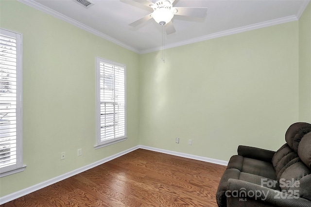 sitting room featuring ceiling fan, crown molding, and hardwood / wood-style flooring