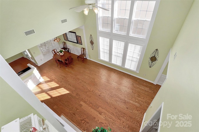 living room with ceiling fan and hardwood / wood-style flooring