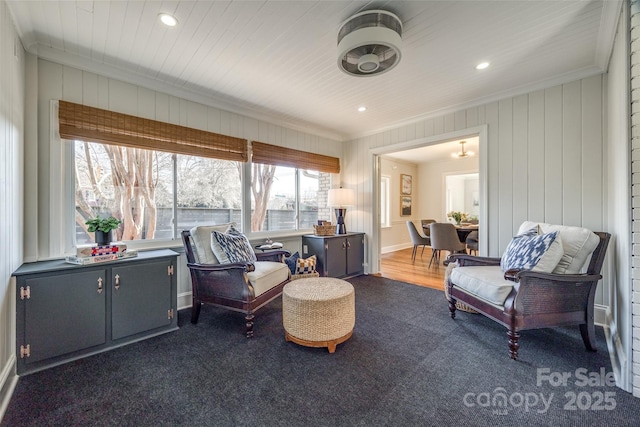 living area with ornamental molding