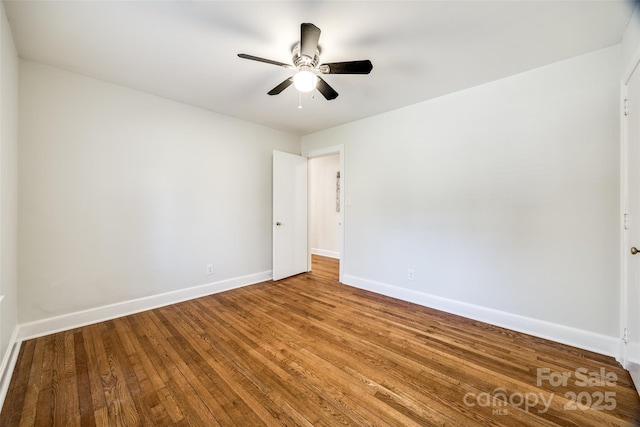 unfurnished room with ceiling fan and hardwood / wood-style flooring