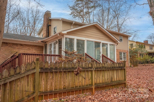 back of house with a sunroom