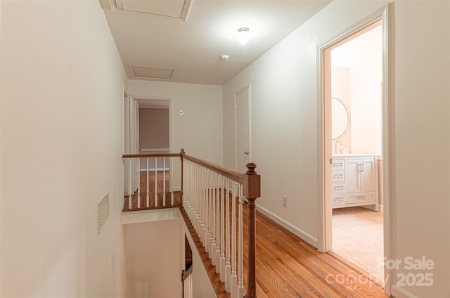 hall with light hardwood / wood-style floors