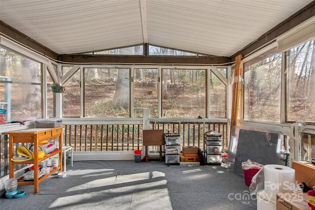 sunroom featuring plenty of natural light and lofted ceiling