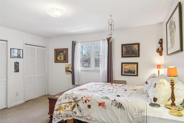 bedroom featuring light colored carpet