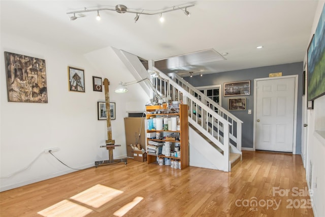 stairway with hardwood / wood-style floors