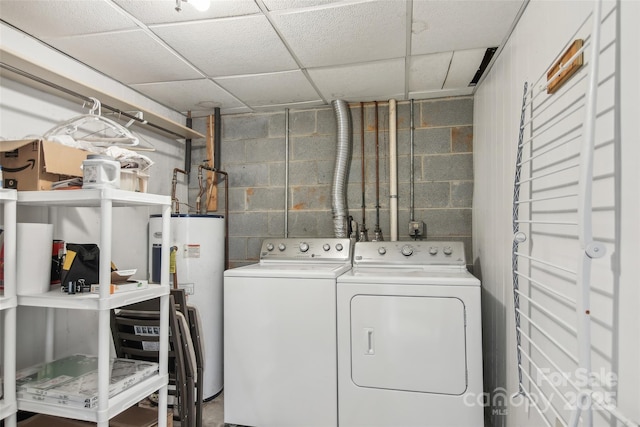 laundry room with separate washer and dryer and electric water heater