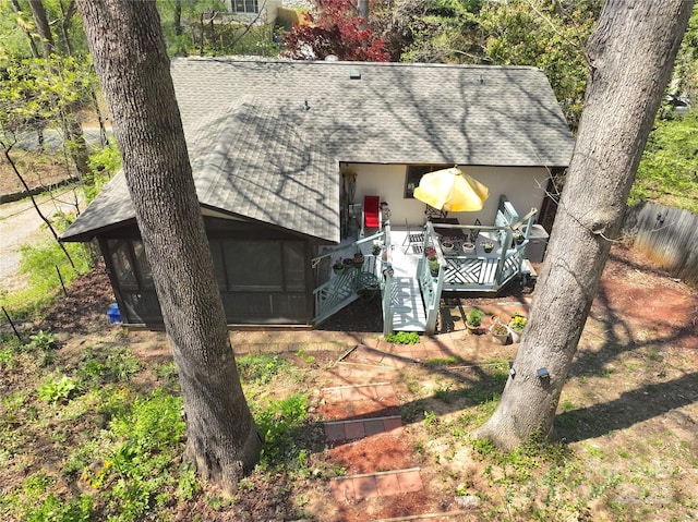 224 Beverly Rd, Asheville, NC 28805 - view of side of property featuring roof with shingles, a sunroom, and stucco siding