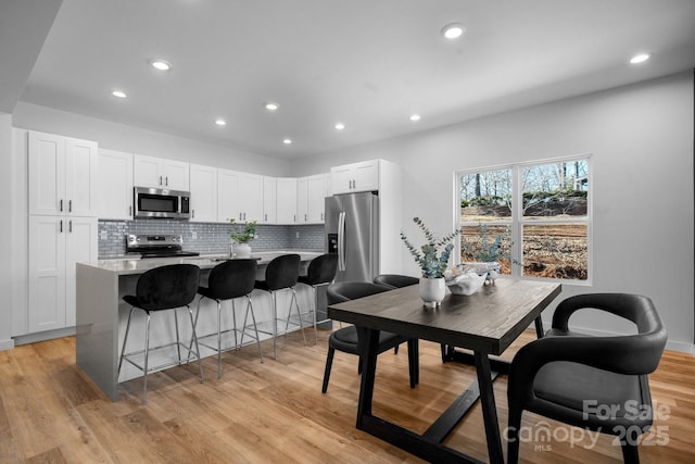 dining area featuring light hardwood / wood-style flooring