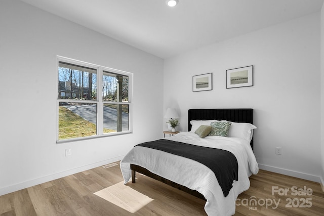 bedroom featuring wood-type flooring