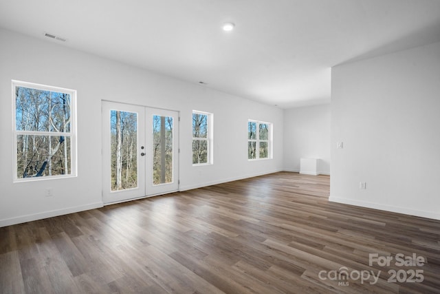 unfurnished living room with french doors and dark hardwood / wood-style floors