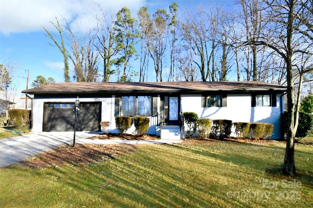 view of front of property with a garage and a front lawn