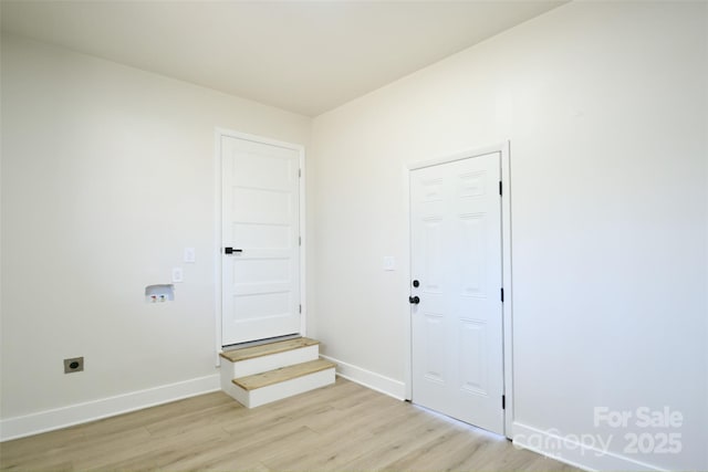 unfurnished room with light wood-type flooring