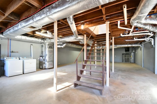 basement with washer and clothes dryer, gas water heater, and heating unit