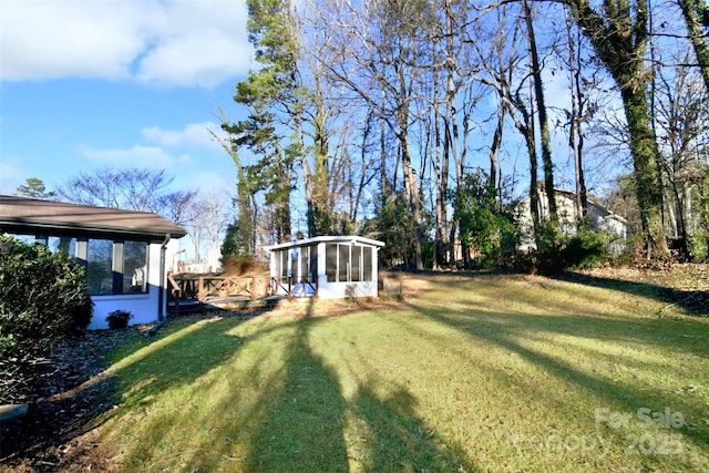 view of yard with a sunroom