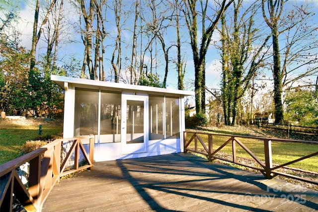 wooden terrace featuring a sunroom