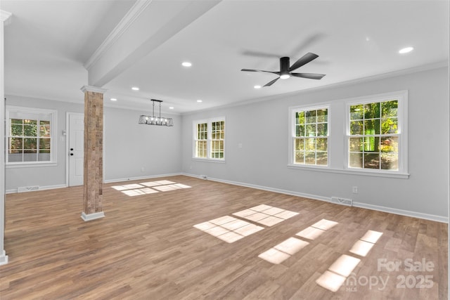 unfurnished living room with decorative columns, ceiling fan, light hardwood / wood-style flooring, and ornamental molding