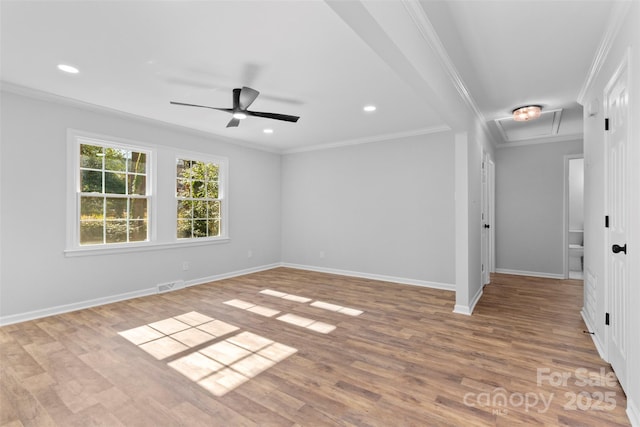 empty room featuring ceiling fan, light hardwood / wood-style floors, and crown molding