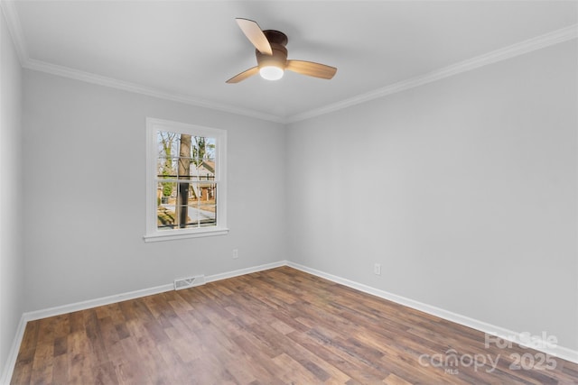 spare room featuring crown molding, hardwood / wood-style floors, and ceiling fan