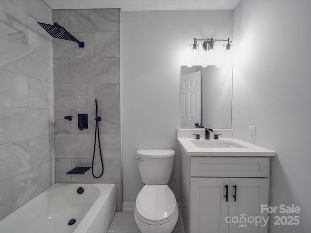 full bathroom featuring vanity, tiled shower / bath combo, and toilet