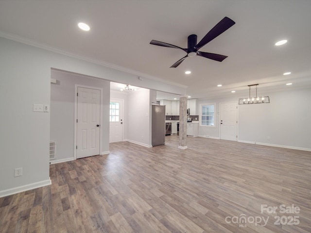 unfurnished living room with light wood-type flooring, ceiling fan, and ornamental molding