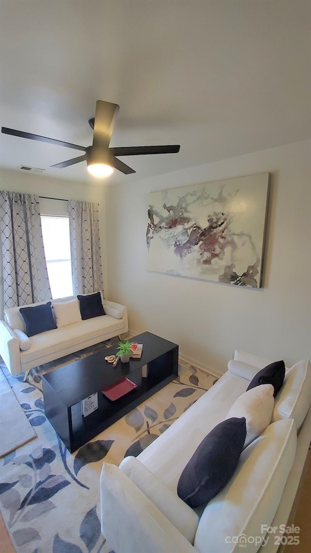 living room featuring ceiling fan