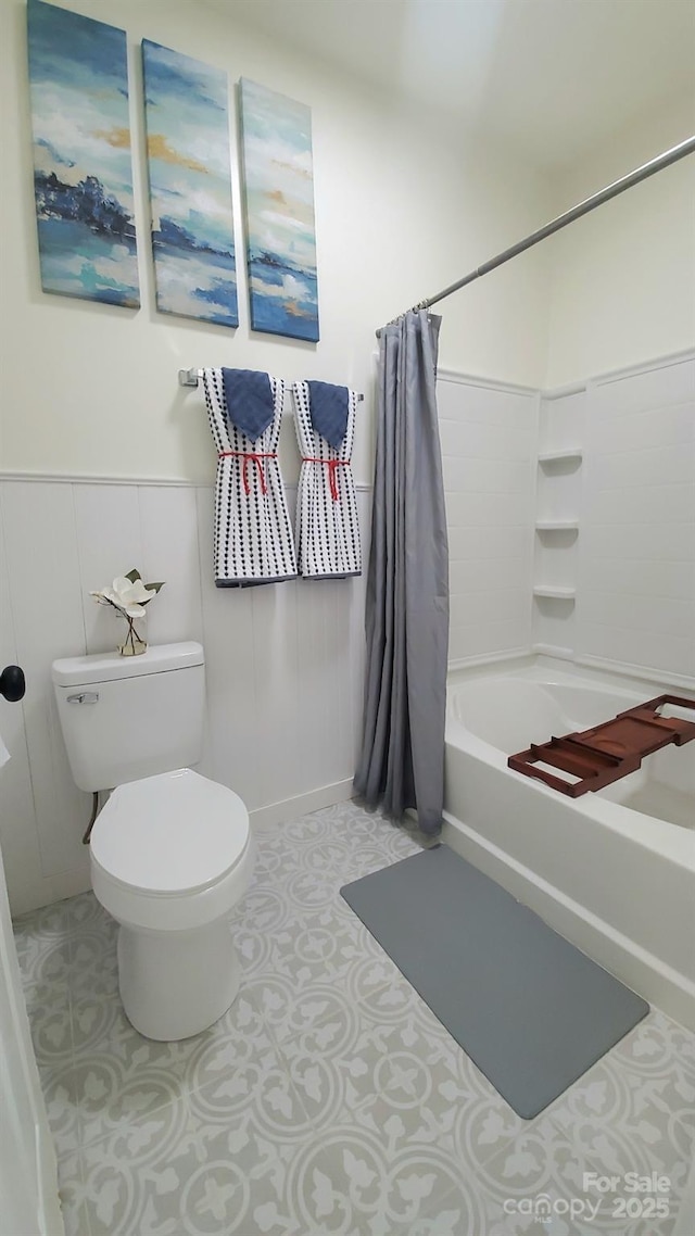 bathroom with tile patterned flooring, toilet, and shower / bath combination with curtain