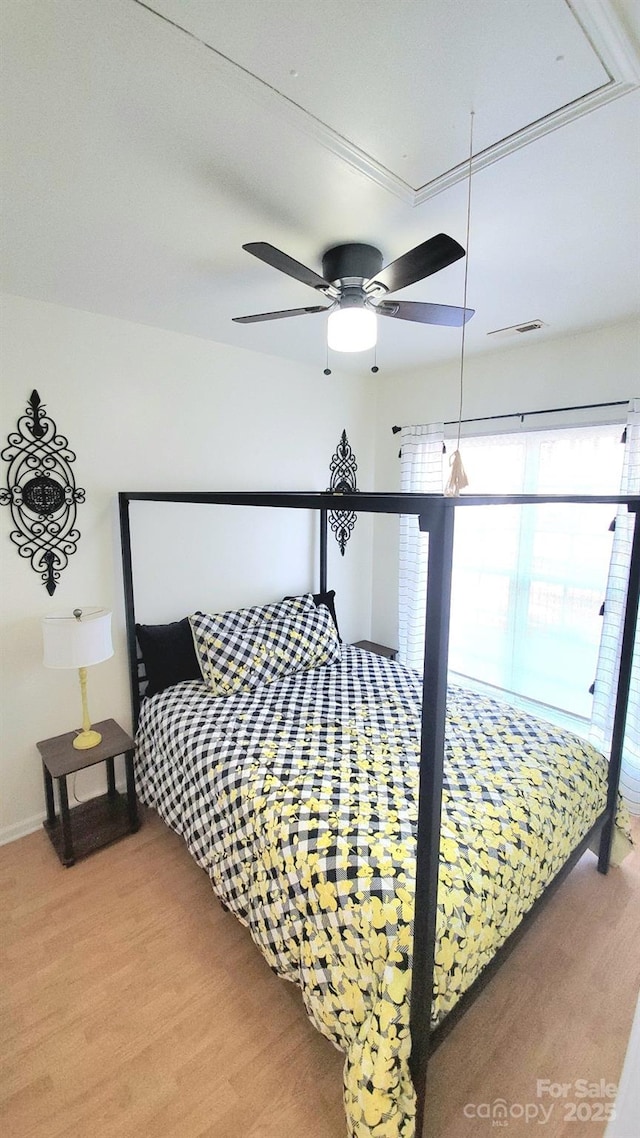 bedroom featuring ceiling fan and wood-type flooring