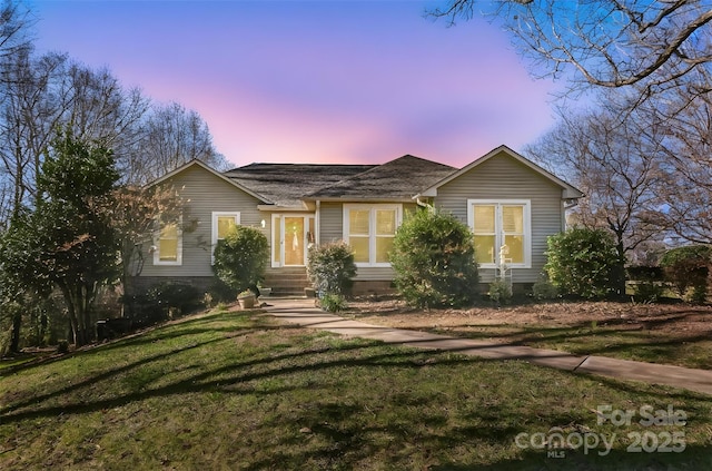 view of front of property with a yard