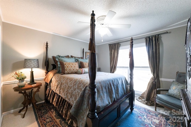 bedroom featuring carpet flooring, ceiling fan, ornamental molding, and a textured ceiling