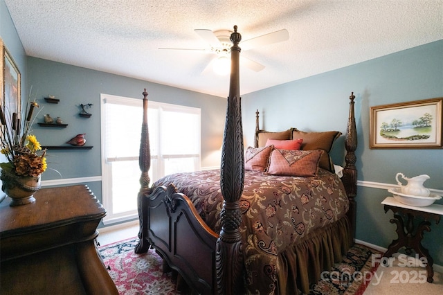 bedroom featuring ceiling fan, a textured ceiling, and light wood-type flooring